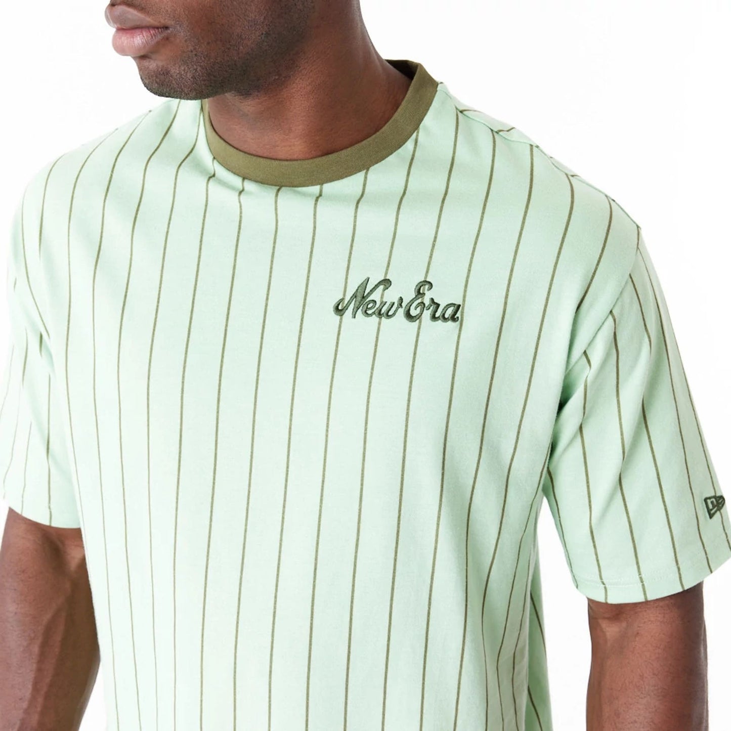 The Male model is wearing New Era Pinstripe Bright Green Oversized T-Shirt 9