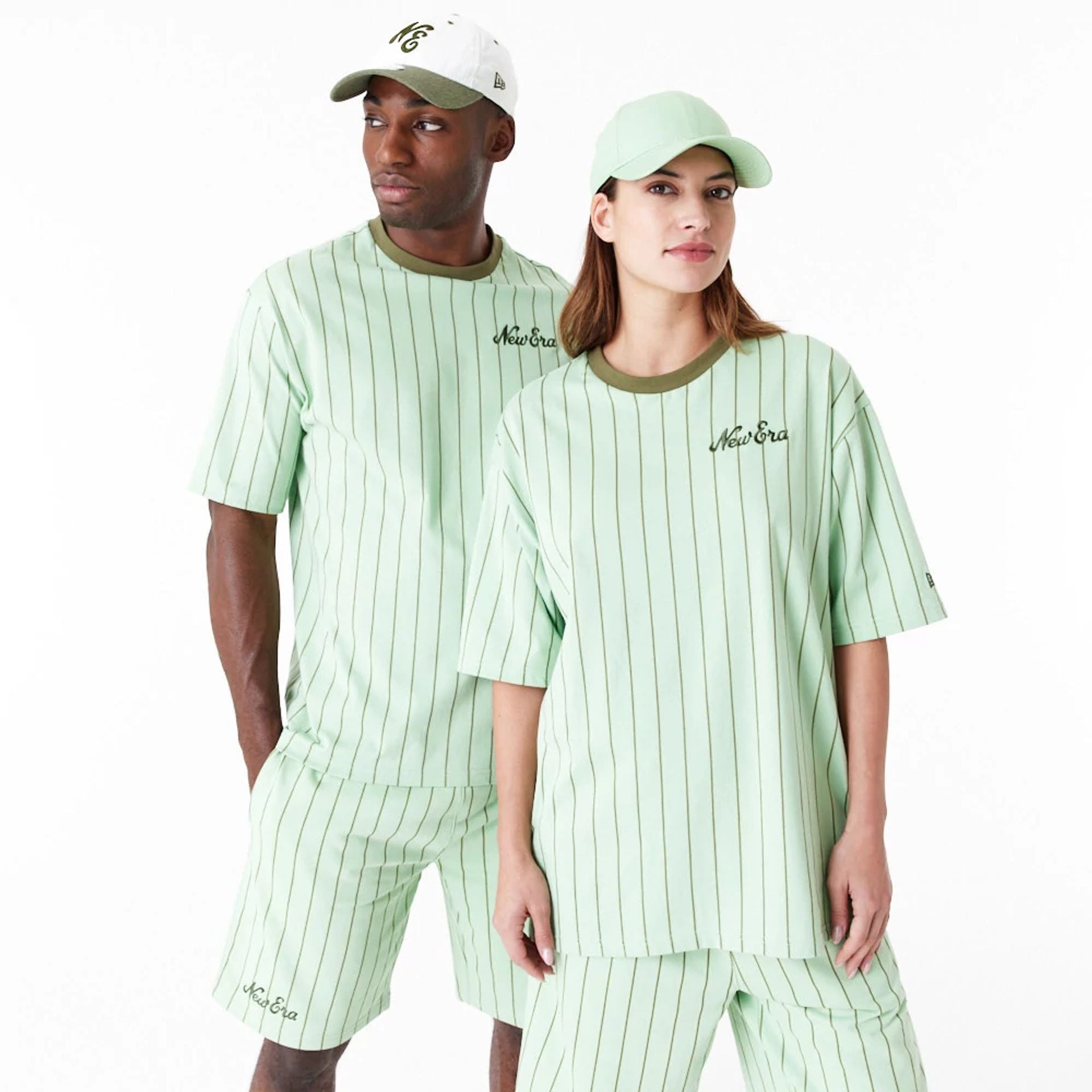 The Male model is wearing New Era Pinstripe Bright Green Oversized T-Shirt 1