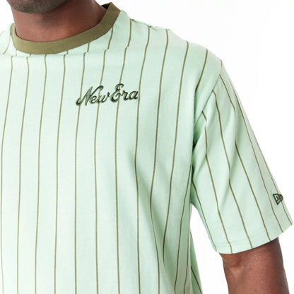 The Male model is wearing New Era Pinstripe Bright Green Oversized T-Shirt 7