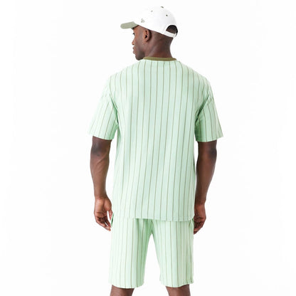 The Male model is wearing New Era Pinstripe Bright Green Oversized T-Shirt 8