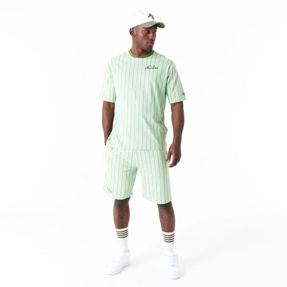 The Male model is wearing New Era Pinstripe Bright Green Oversized T-Shirt 4