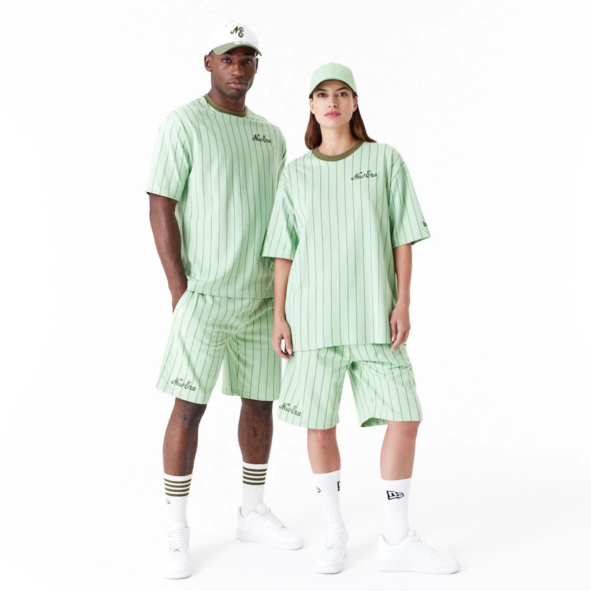 The Male model is wearing New Era Pinstripe Bright Green Oversized T-Shirt 5