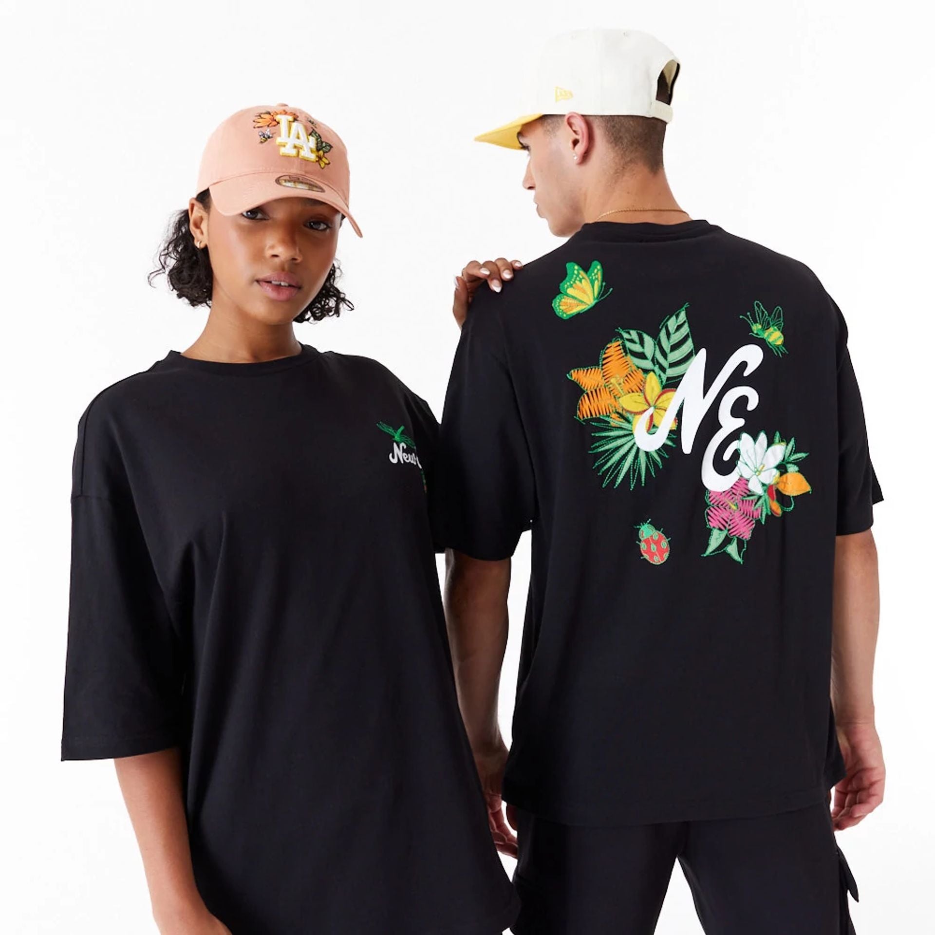 The Male model is wearing New Era Floral Graphic Black Oversized T-Shirt 1