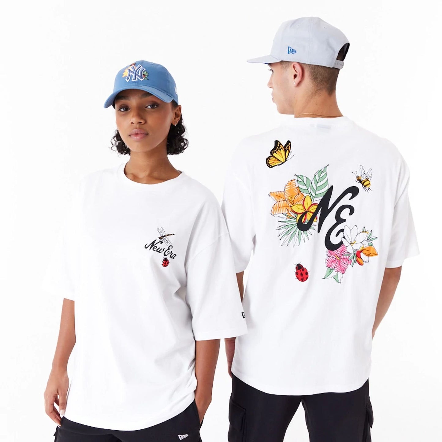 The Male model is wearing New Era Floral Graphic White Oversized T-Shirt 1