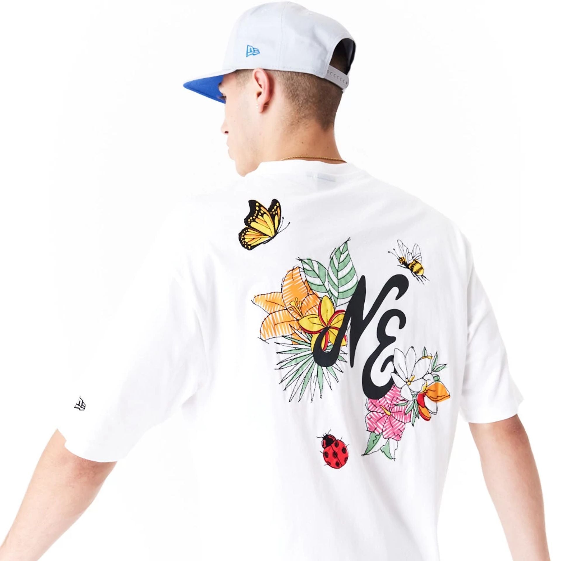 The Male model is wearing New Era Floral Graphic White Oversized T-Shirt 6