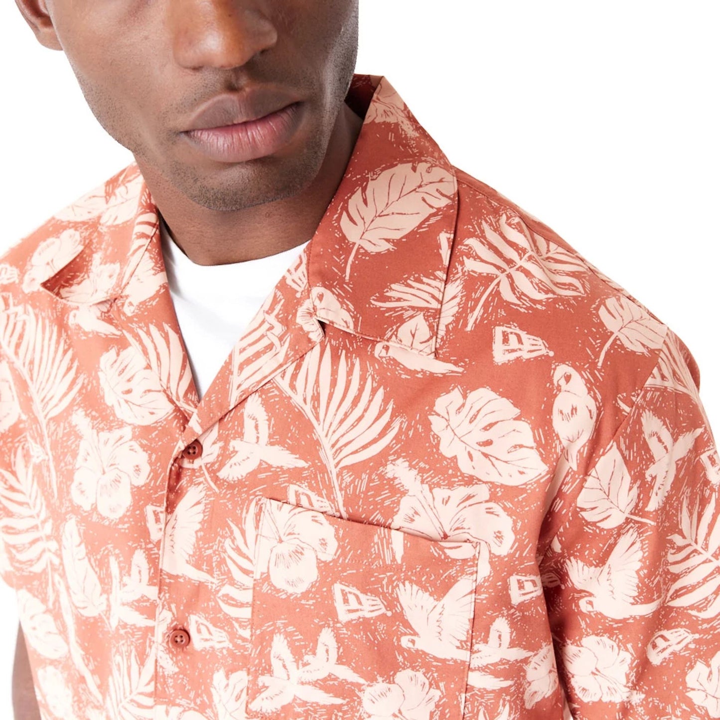 The Male model is wearing New Era All Over Print Brown Woven Short Sleeve Shirt 3