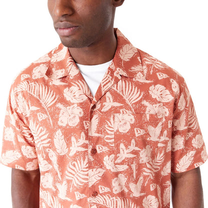 The Male model is wearing New Era All Over Print Brown Woven Short Sleeve Shirt 5