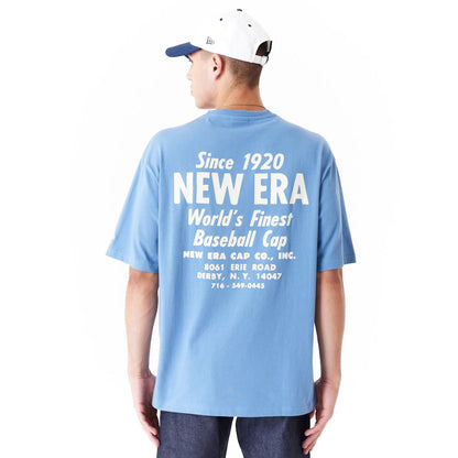 The Male model is wearing New Era Graphic Blue Oversized T-Shirt 1