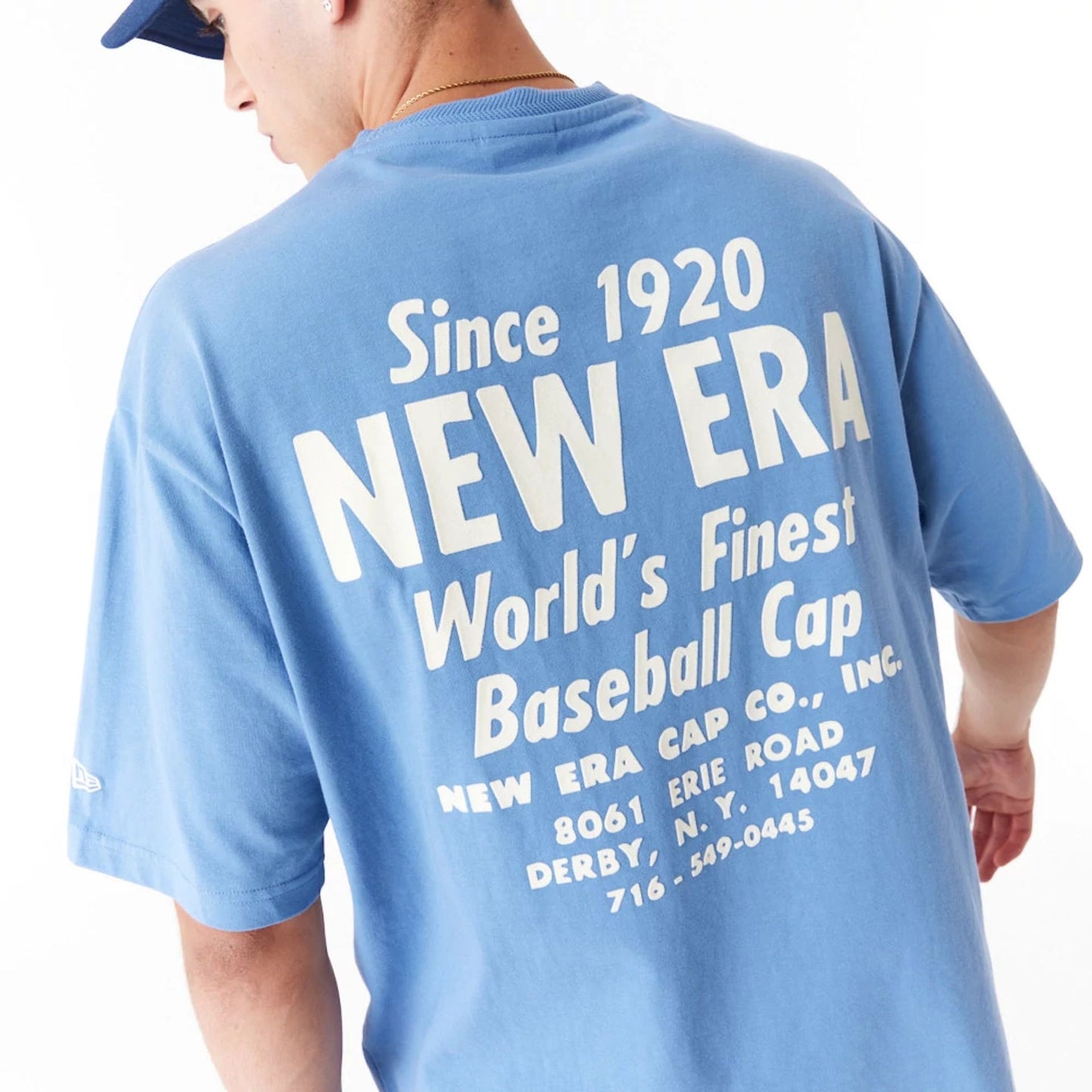 The Male model is wearing New Era Graphic Blue Oversized T-Shirt 7