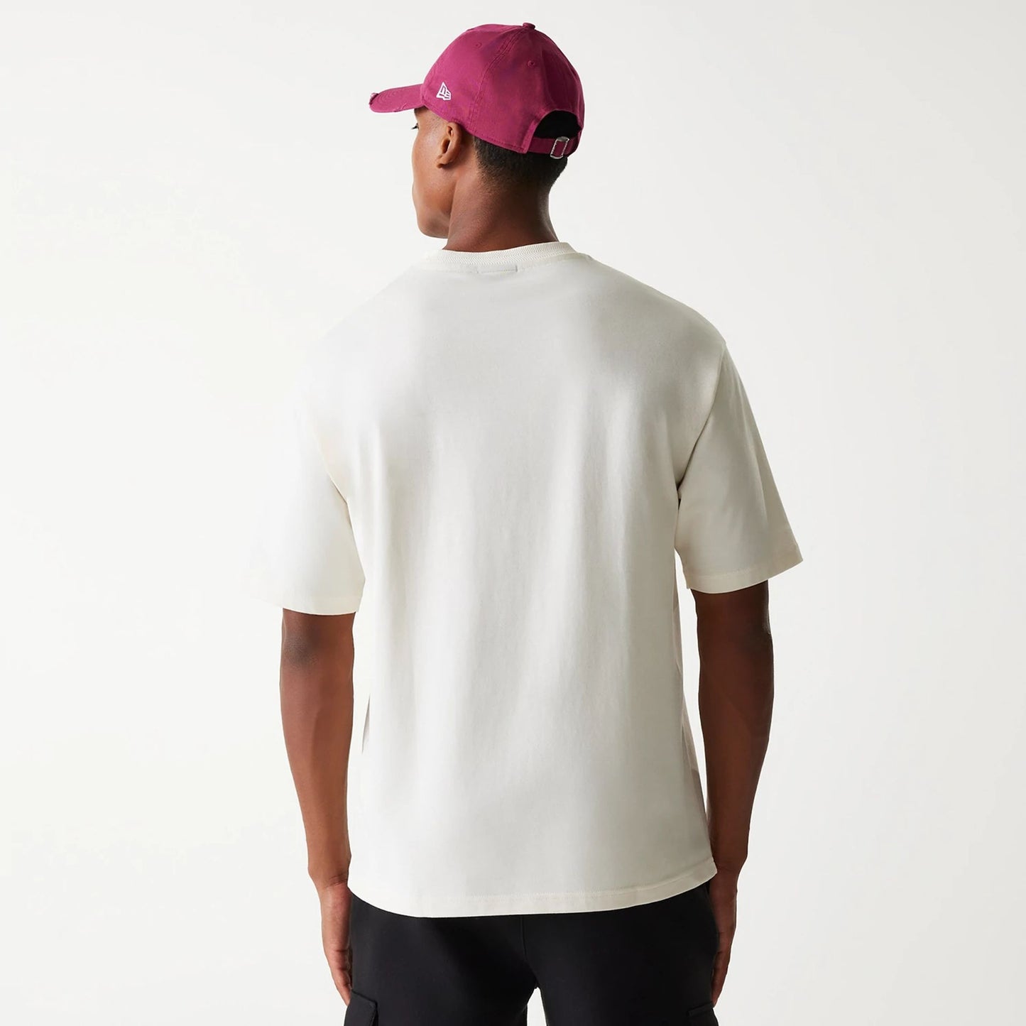 The Male model is wearing New Era Graphic White Oversized T-Shirt 8