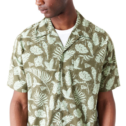 The Male model is wearing New Era All Over Print Green Woven Short Sleeve Shirt 2