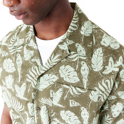 The Male model is wearing New Era All Over Print Green Woven Short Sleeve Shirt 4