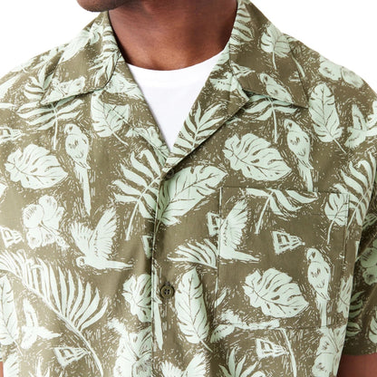 The Male model is wearing New Era All Over Print Green Woven Short Sleeve Shirt 5