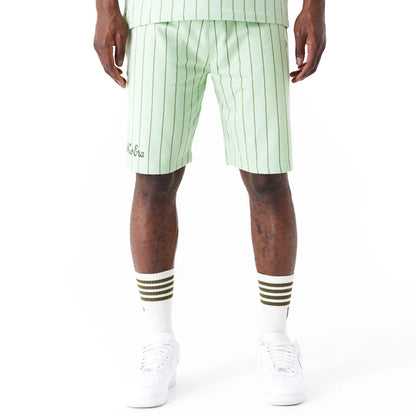 The Male model is wearing New Era Pinstripe Bright Green Shorts 1