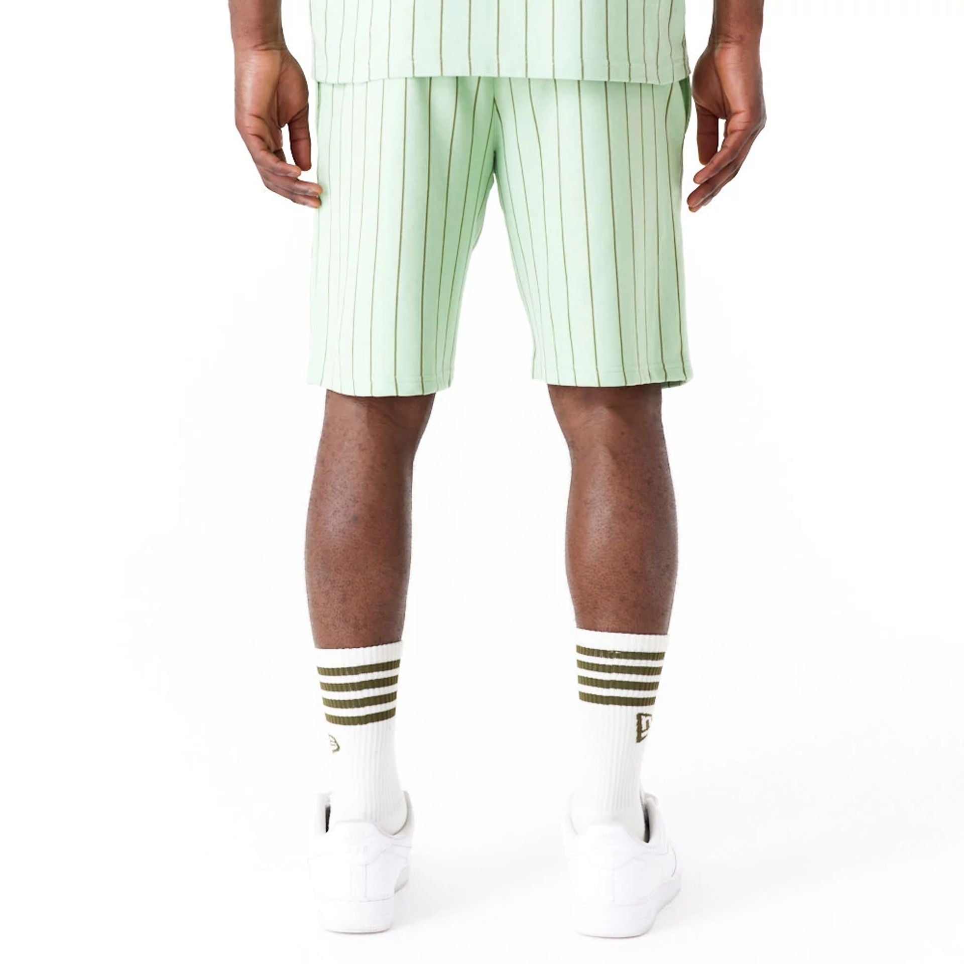 The Male model is wearing New Era Pinstripe Bright Green Shorts 3