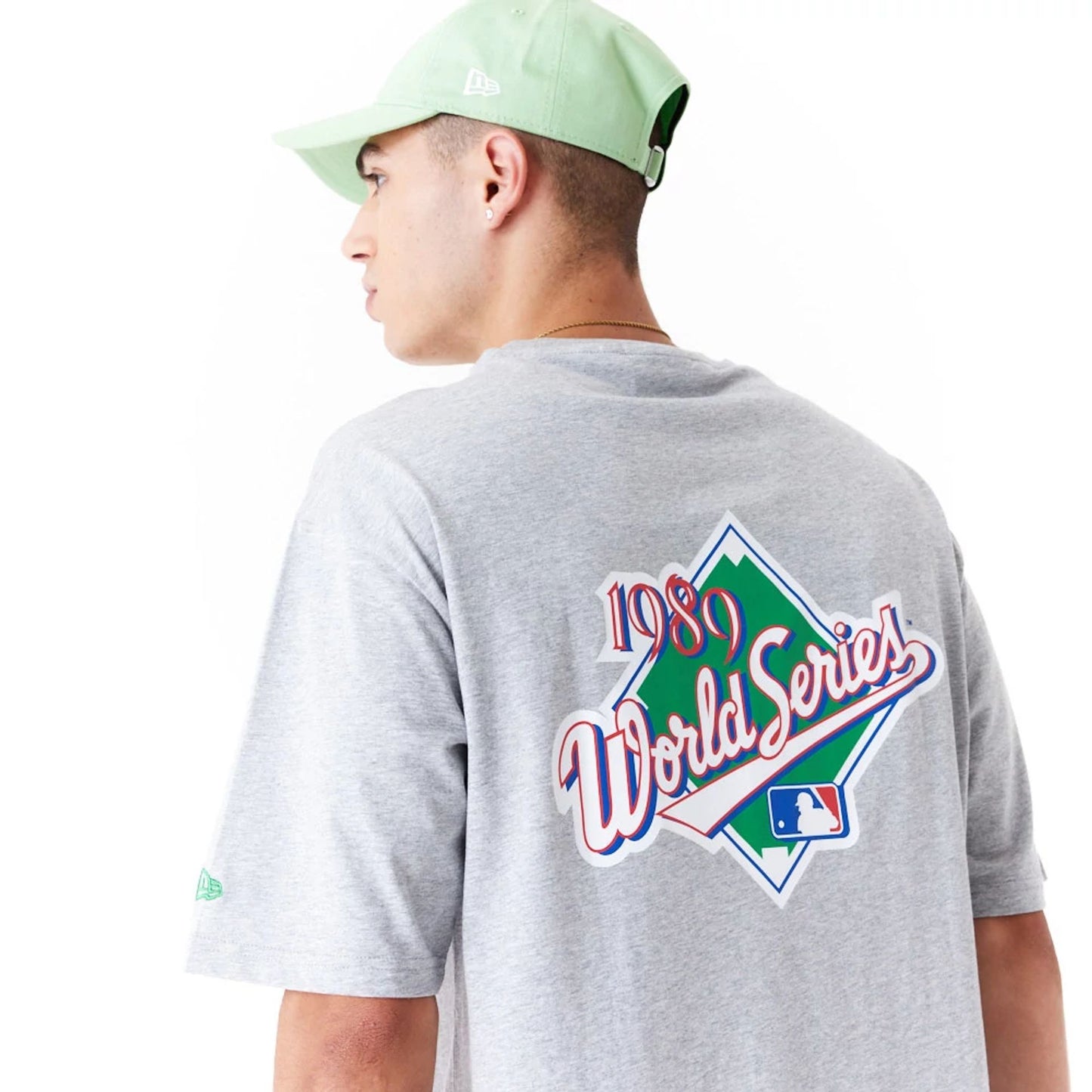 The Male model is wearing Oakland Athletics MLB World Series Grey Oversized T-Shirt 6