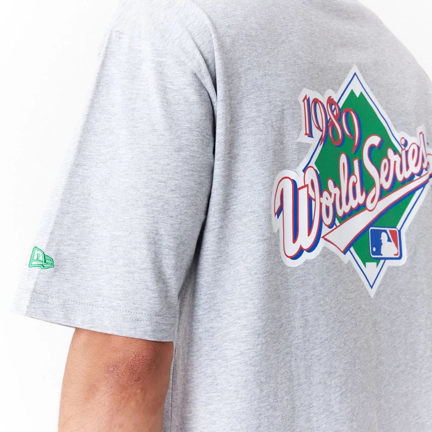 The Male model is wearing Oakland Athletics MLB World Series Grey Oversized T-Shirt 8