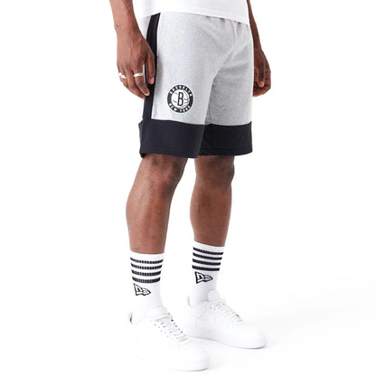 The Male model is wearing Brooklyn Nets NBA Colour Block Grey Shorts 2