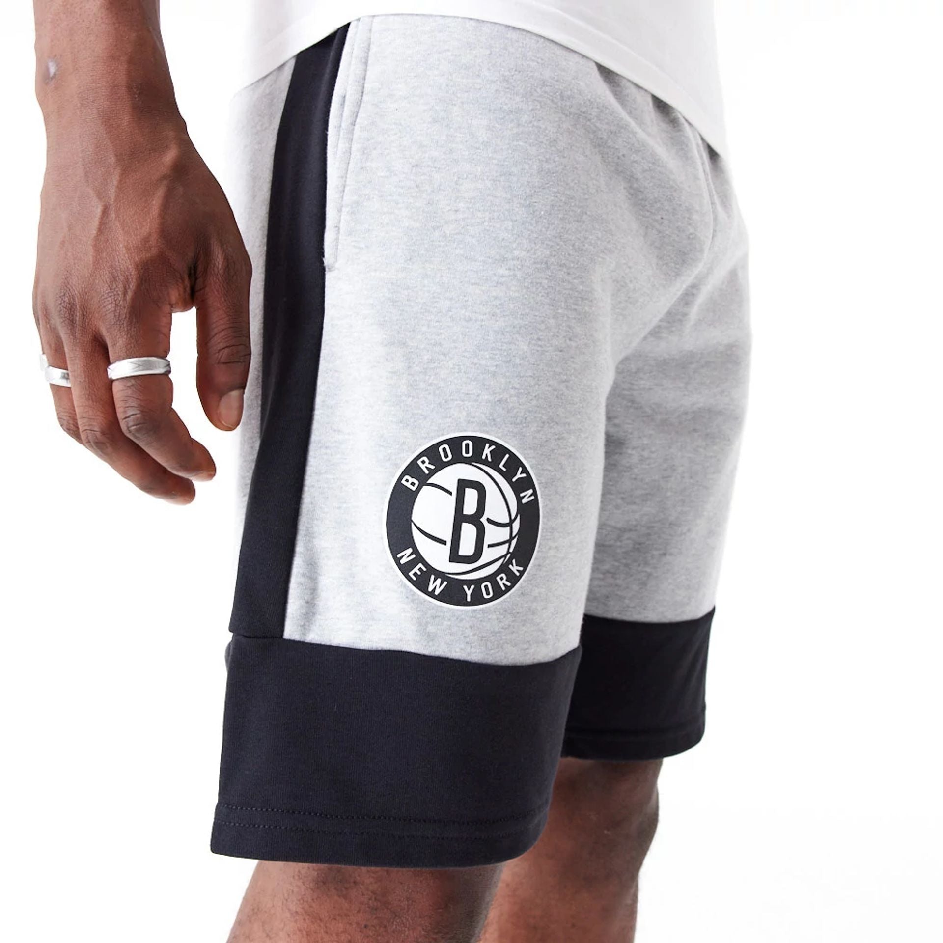 The Male model is wearing Brooklyn Nets NBA Colour Block Grey Shorts 4