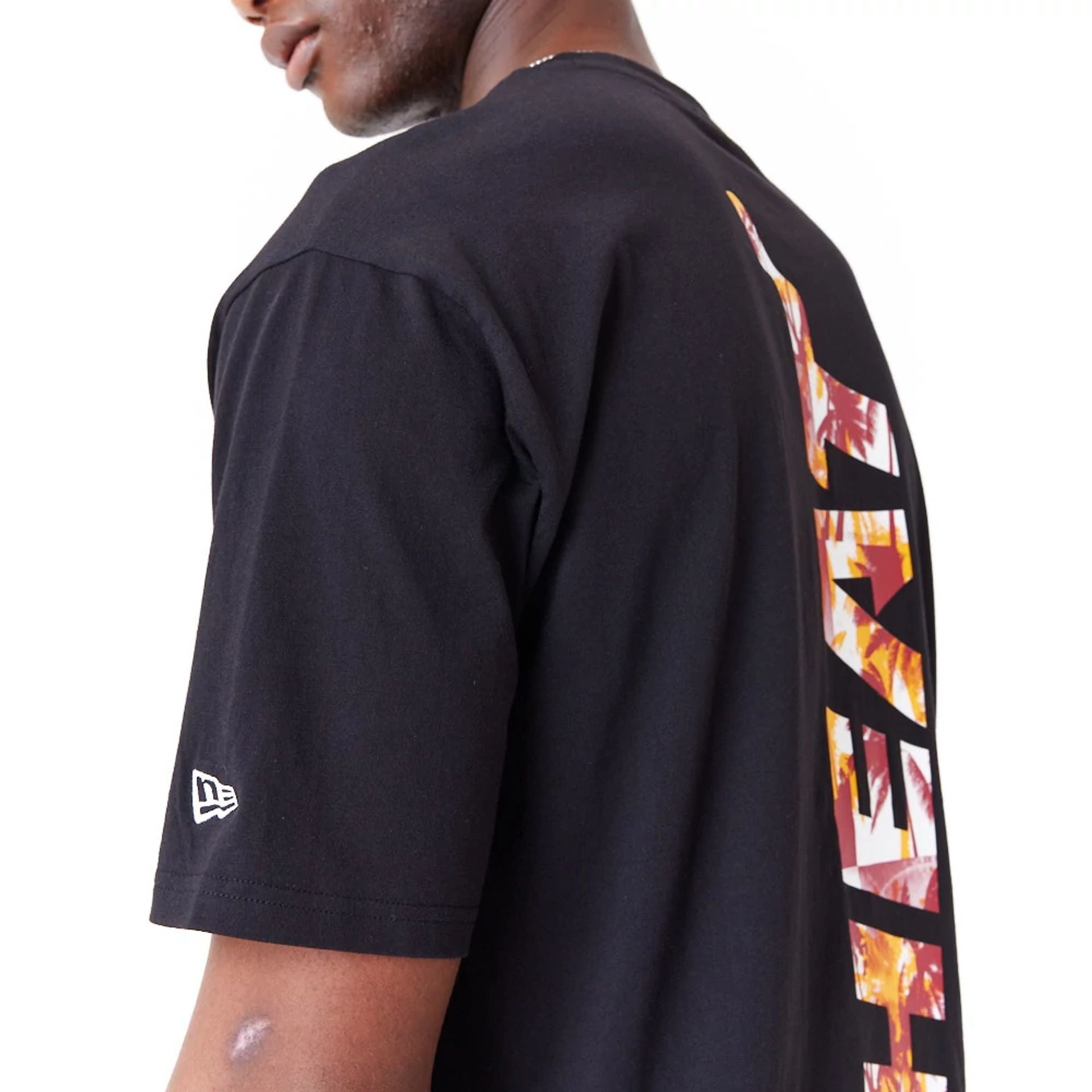 The Male model is wearing Miami Heat NBA Large Infill Black Oversized T-Shirt 5