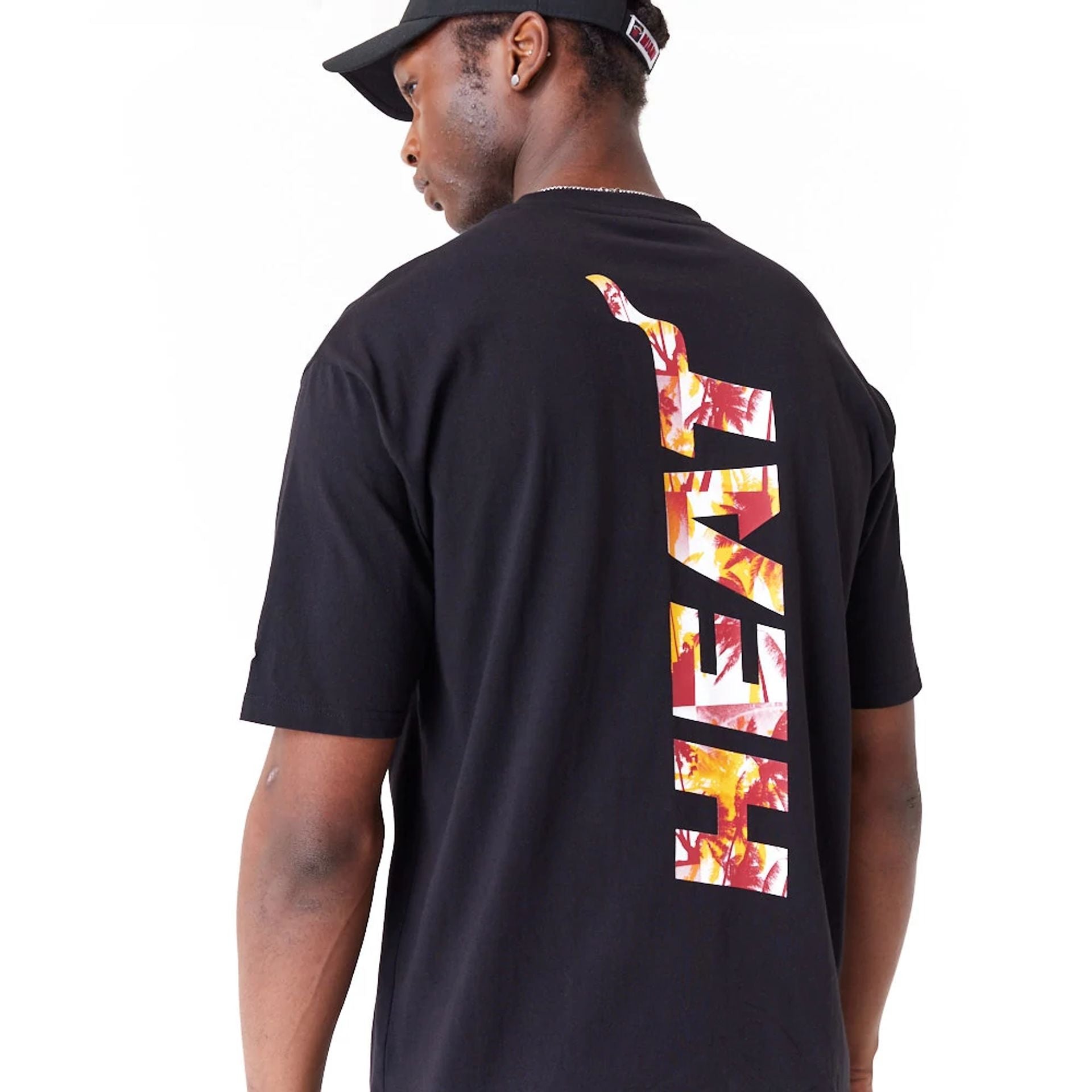 The Male model is wearing Miami Heat NBA Large Infill Black Oversized T-Shirt 2