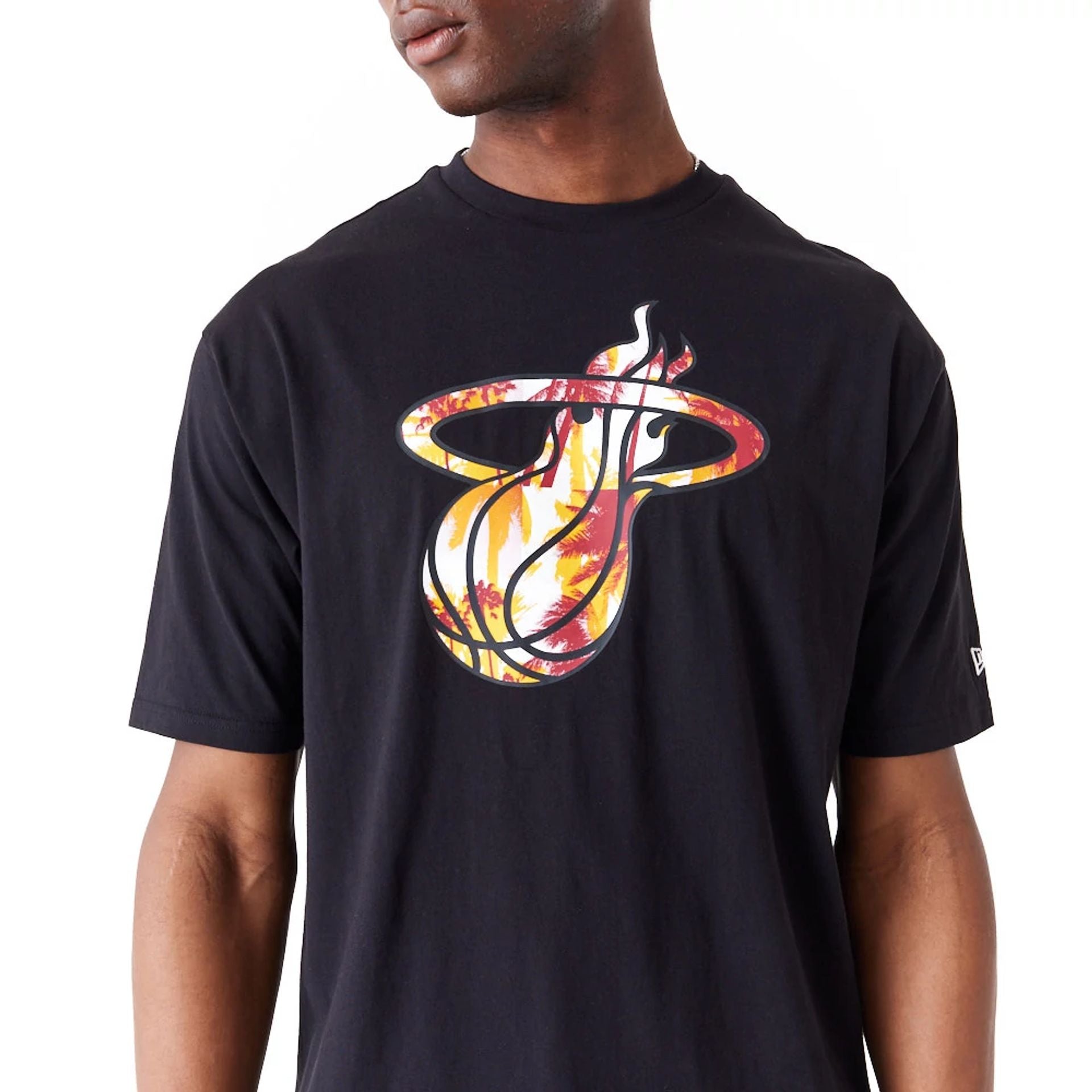 The Male model is wearing Miami Heat NBA Large Infill Black Oversized T-Shirt 3