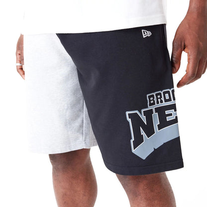 The Male model is wearing Brooklyn Nets NBA Graphic Grey Shorts 6