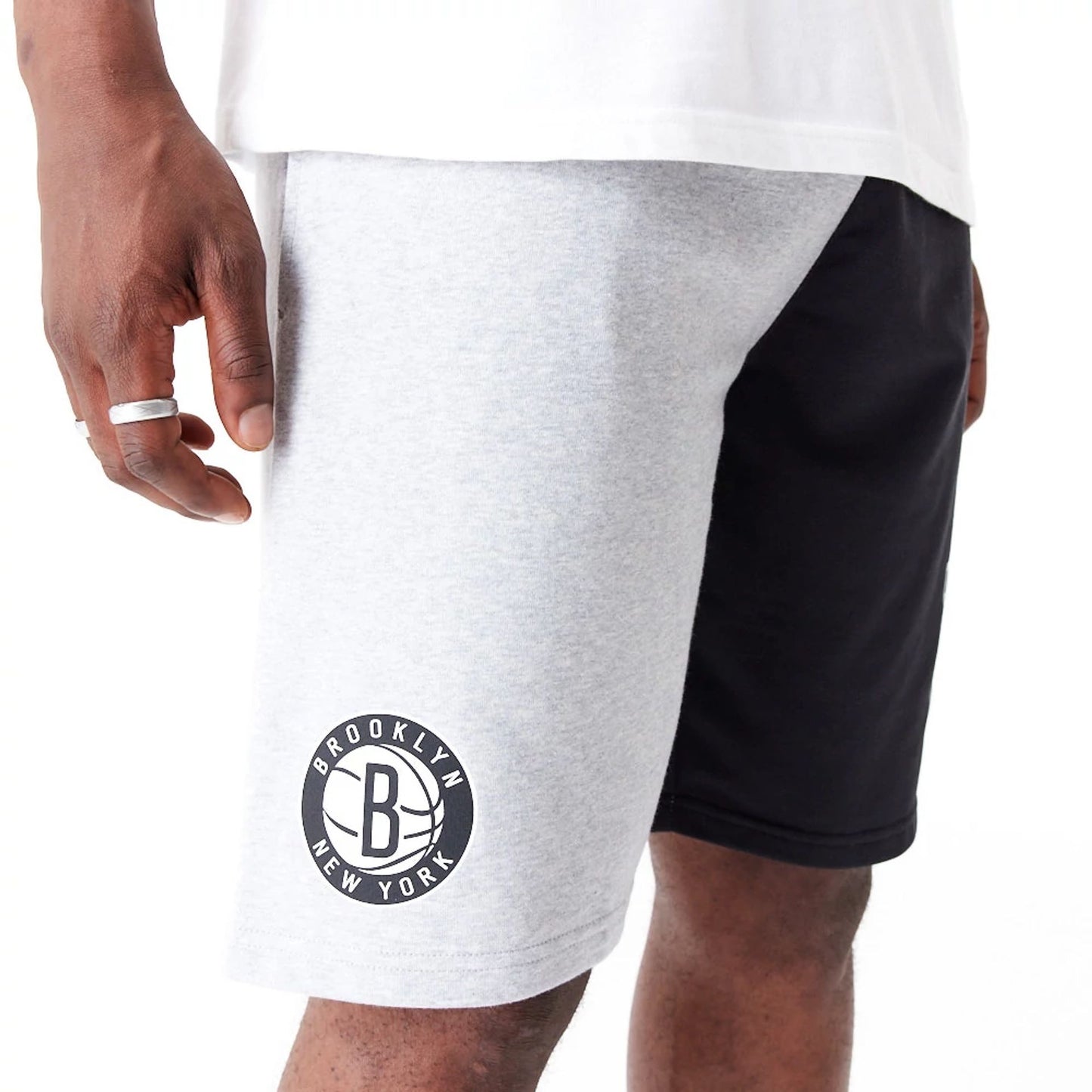 The Male model is wearing Brooklyn Nets NBA Graphic Grey Shorts 7