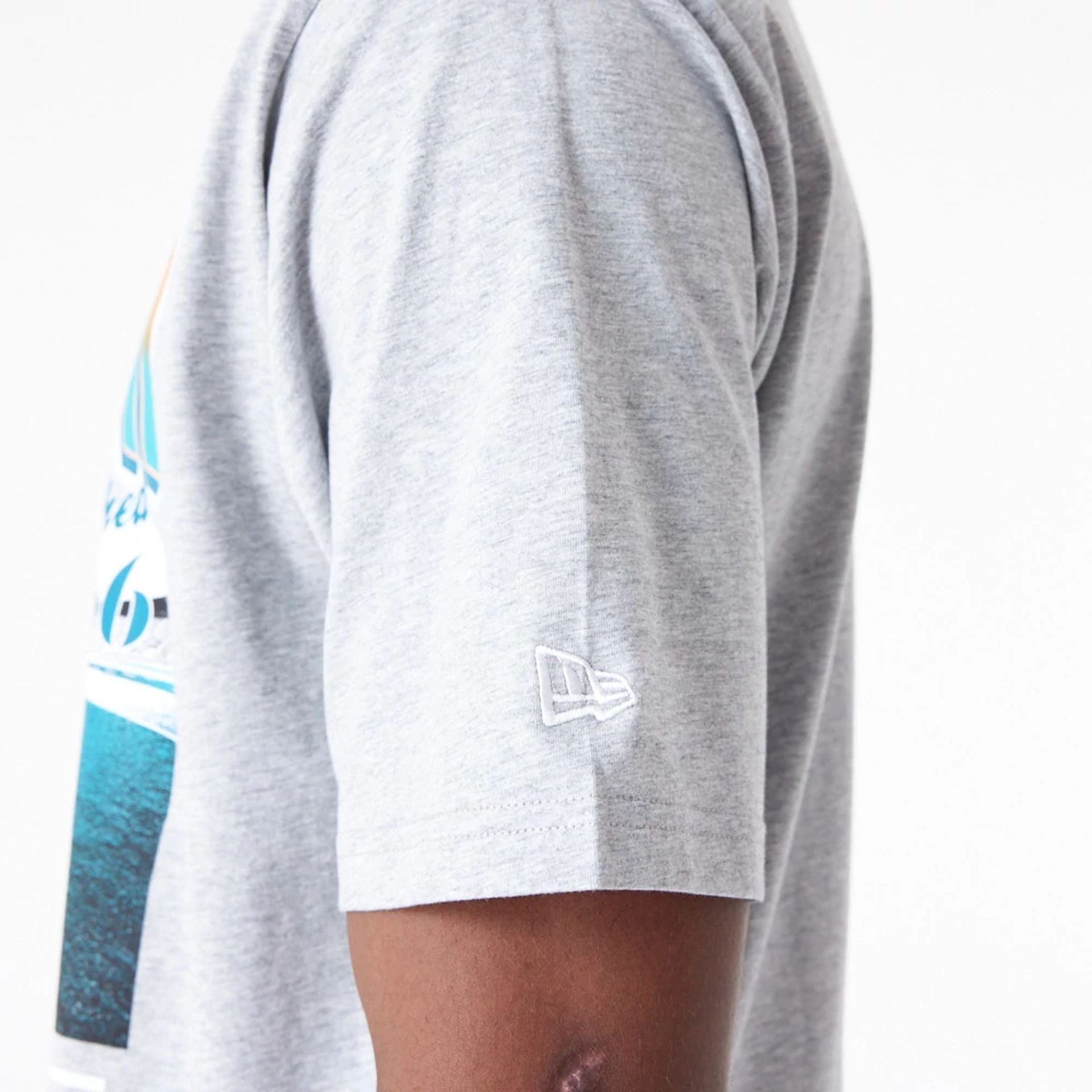 The Male model is wearing Miami Dolphins NFL Team Graphic Grey Oversized T-Shirt 5