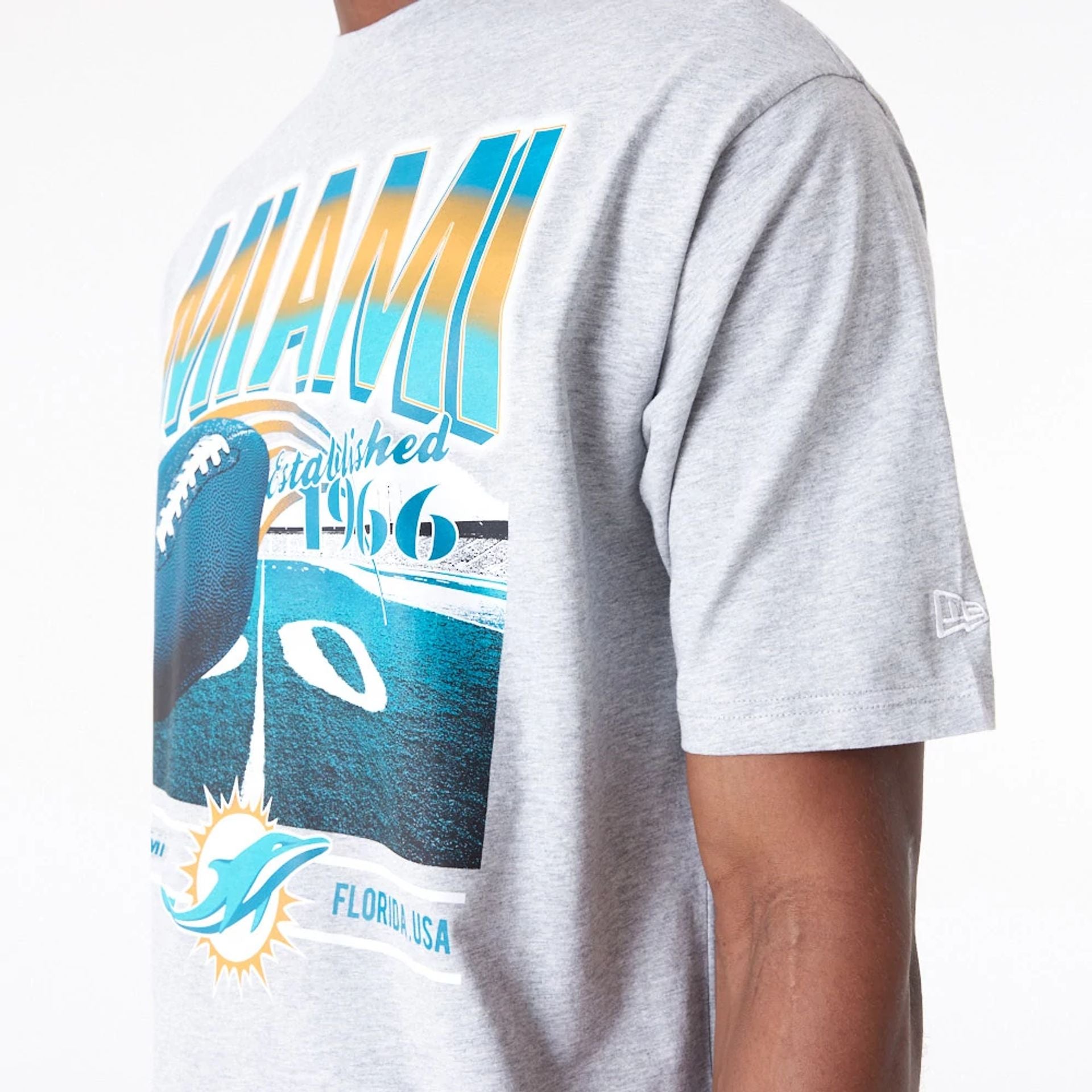 The Male model is wearing Miami Dolphins NFL Team Graphic Grey Oversized T-Shirt 2