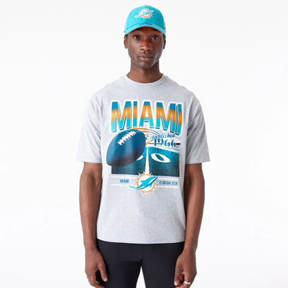 The Male model is wearing Miami Dolphins NFL Team Graphic Grey Oversized T-Shirt 1