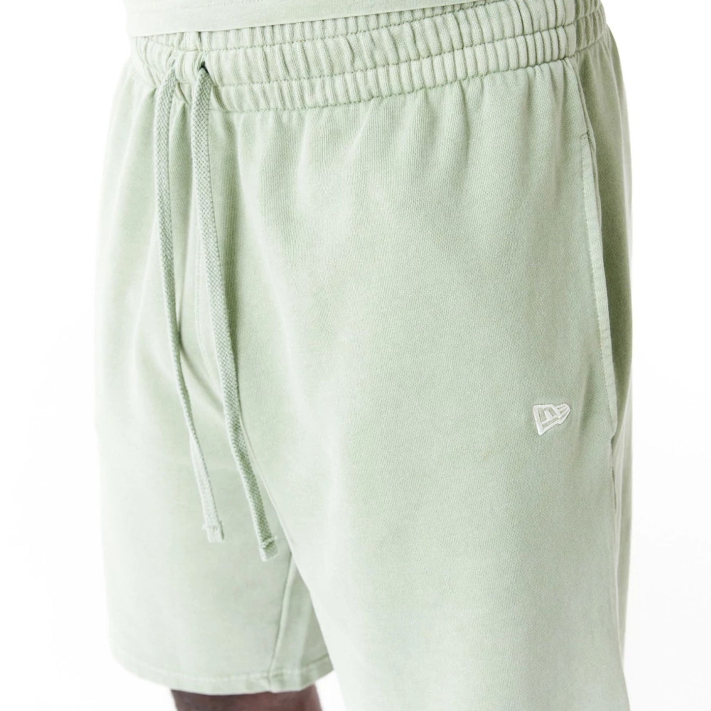 The Male model is wearing New Era Washed Green Shorts 4