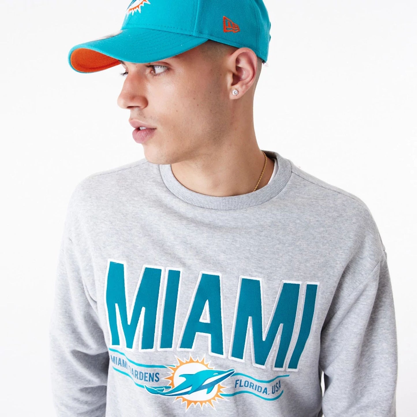 The Male model is wearing Miami Dolphins NFL Wordmark Grey Oversized Crew Neck Sweatshirt 5