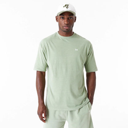 The Male model is wearing New Era Washed Green Oversized T-Shirt 1