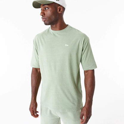 The Male model is wearing New Era Washed Green Oversized T-Shirt 5