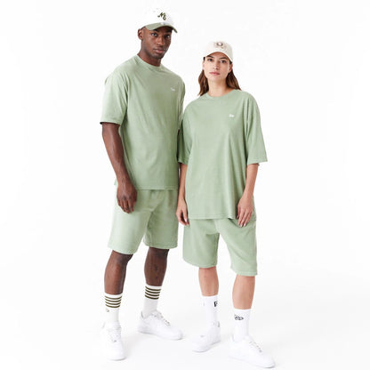 The Male model is wearing New Era Washed Green Oversized T-Shirt 10