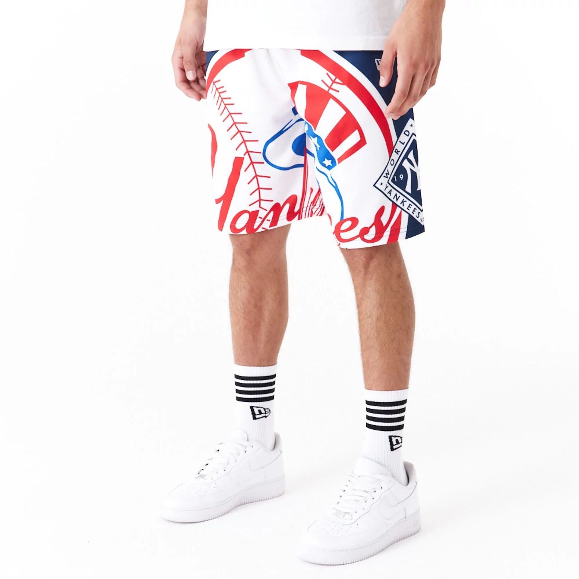 The Male model is wearing New York Yankees MLB Large Logo Dark Blue Shorts 2