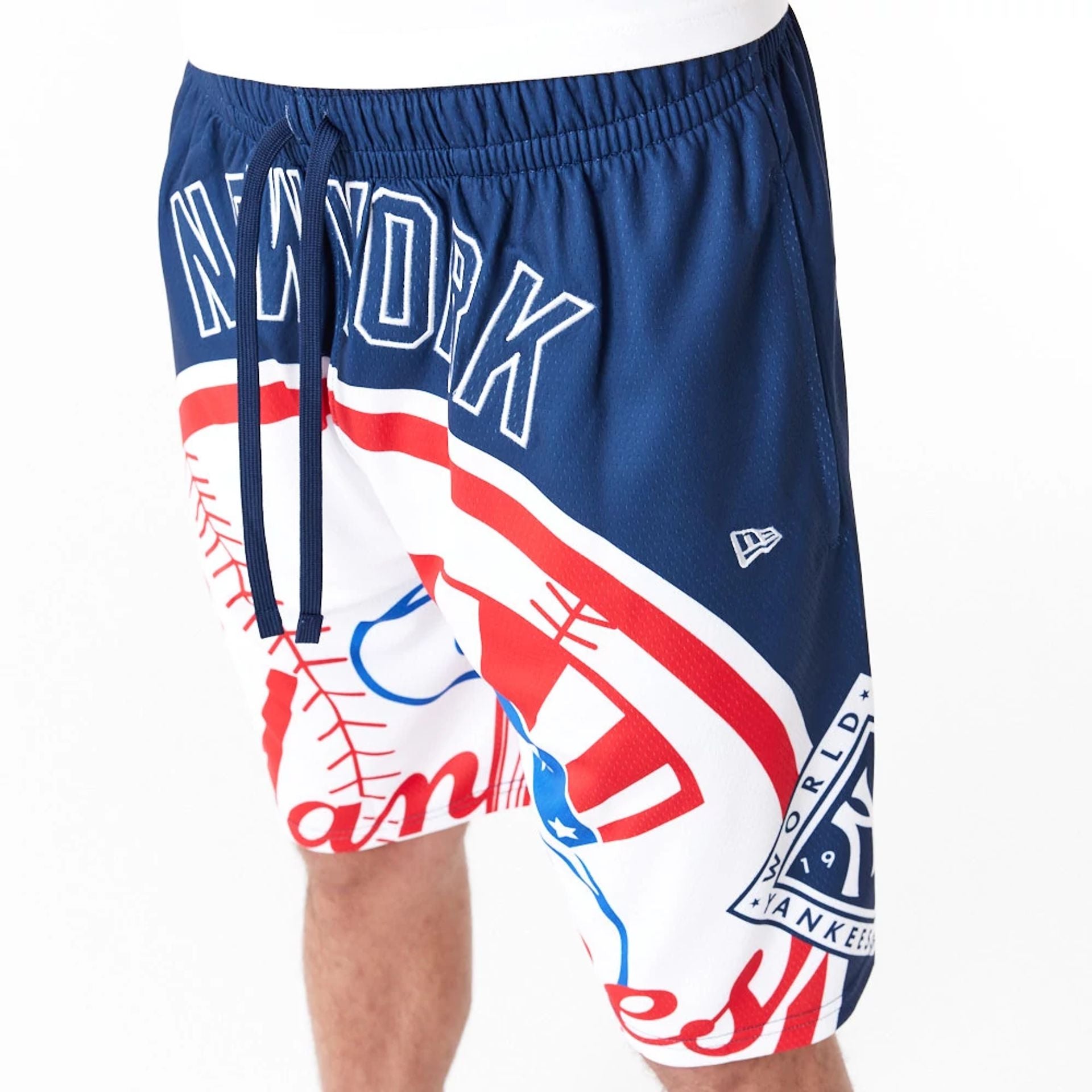 The Male model is wearing New York Yankees MLB Large Logo Dark Blue Shorts 6