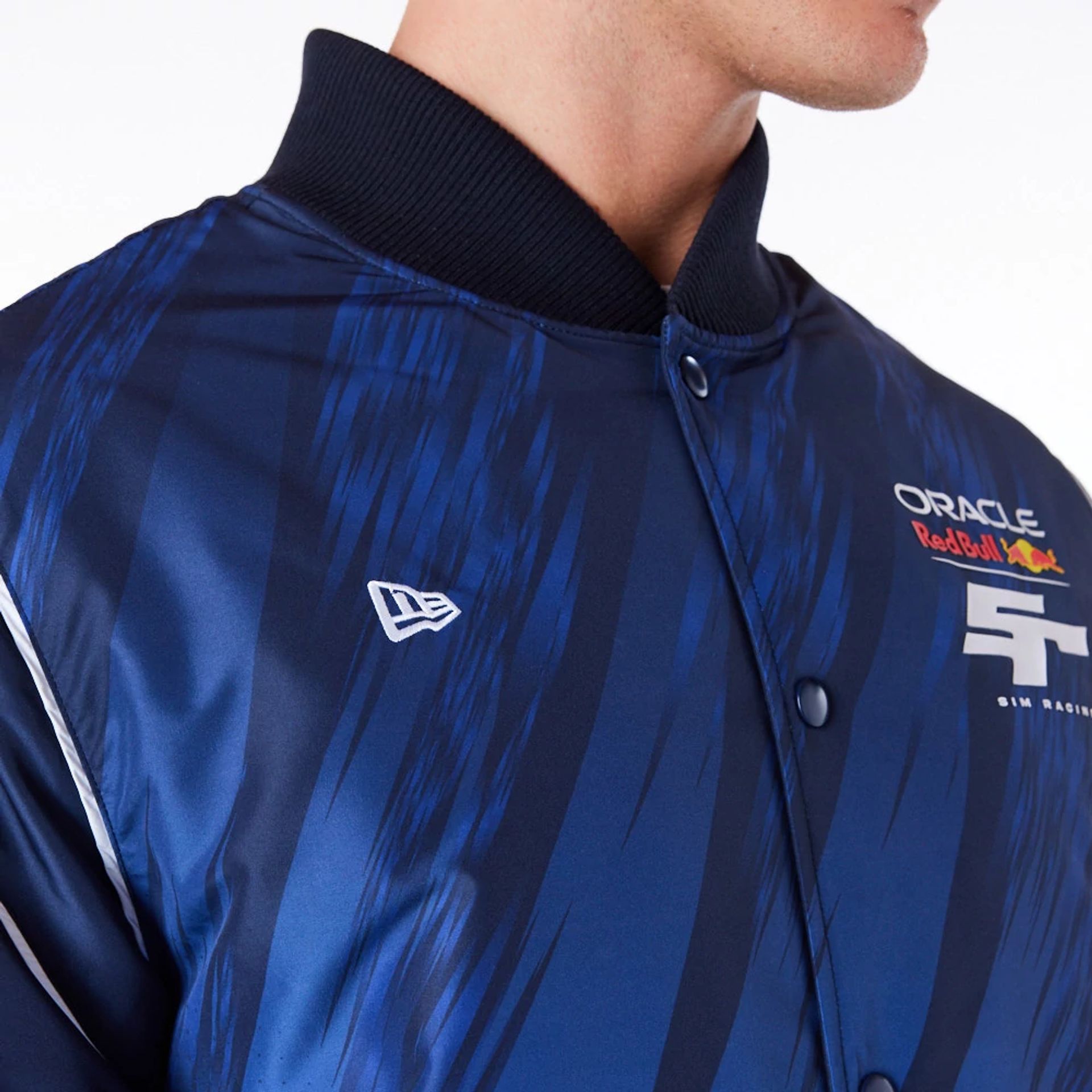 The Male model is wearing Red Bull Sim Racing Navy Bomber Jacket 3