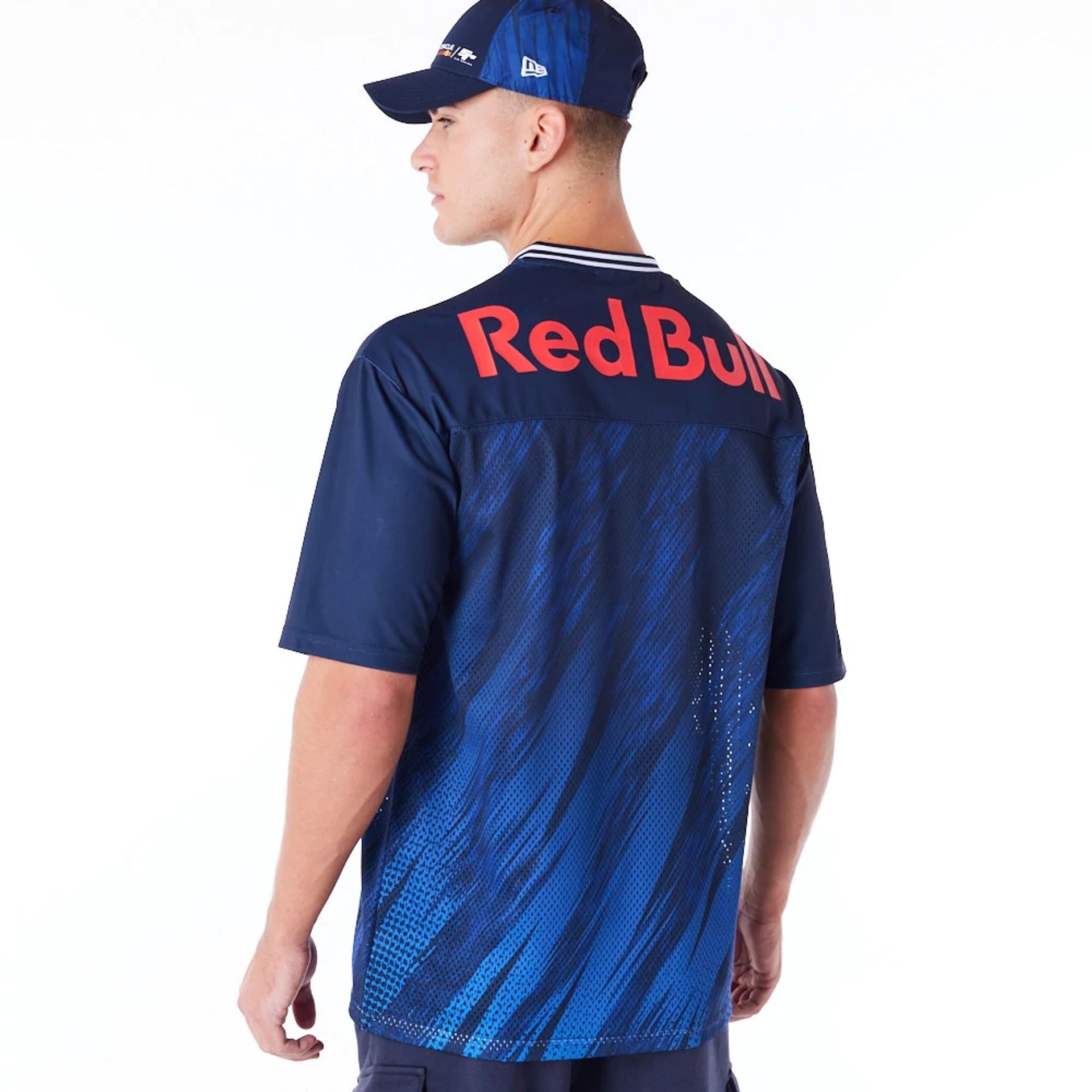 The Male model is wearing Red Bull  Sim Racing Navy V Neck Jersey 7