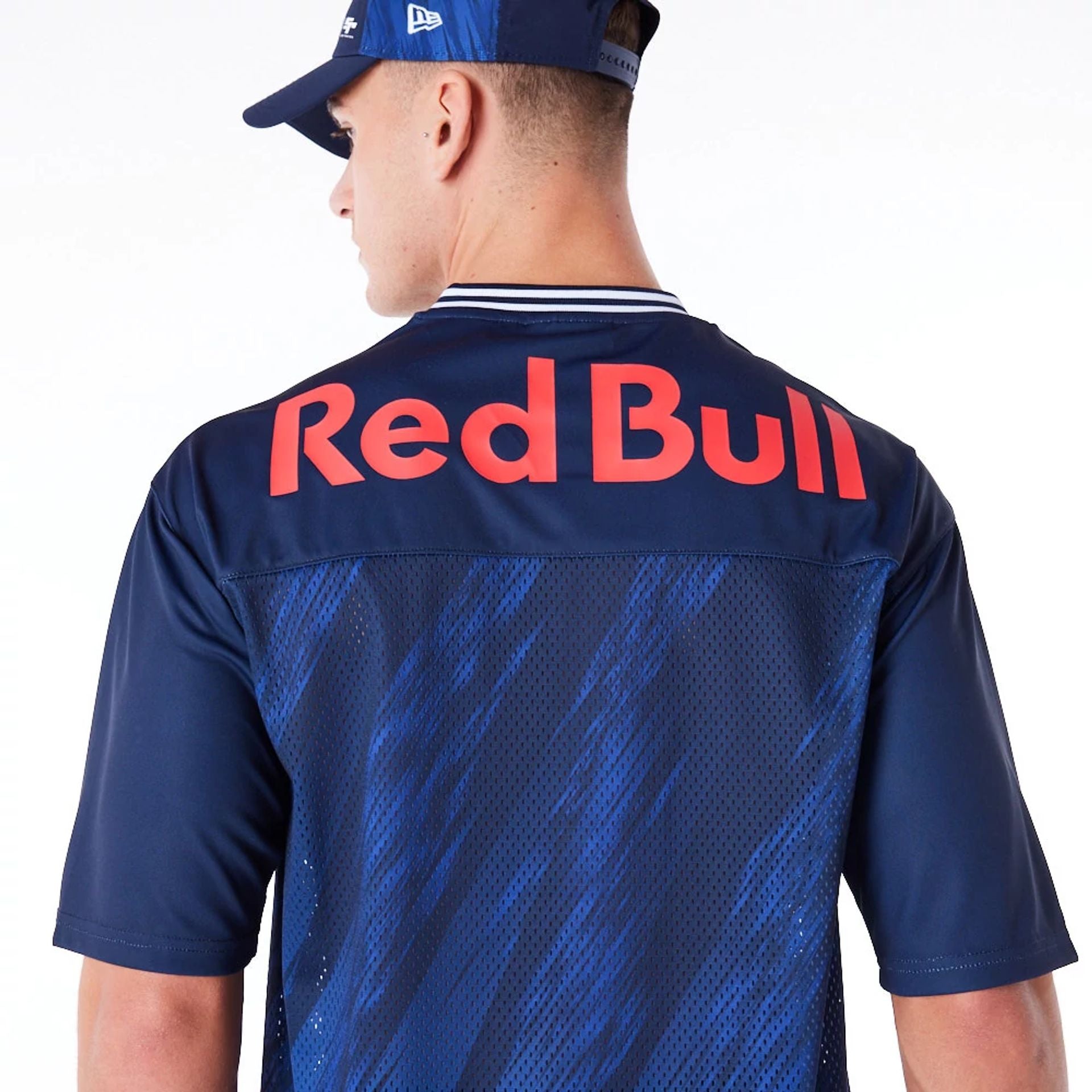 The Male model is wearing Red Bull  Sim Racing Navy V Neck Jersey 8