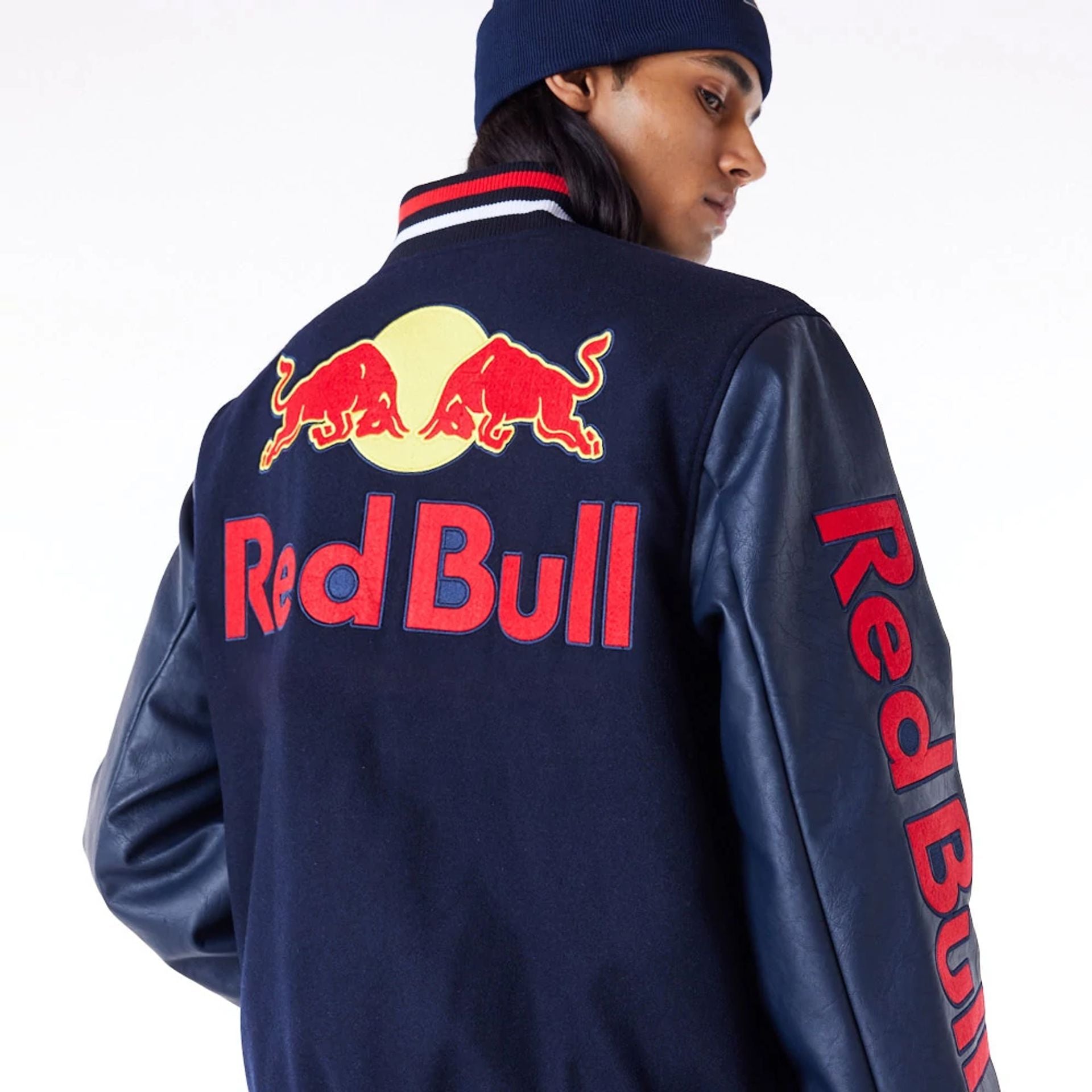 The Male model is wearing Red Bull Sim Racing Navy Varsity Jacket 4