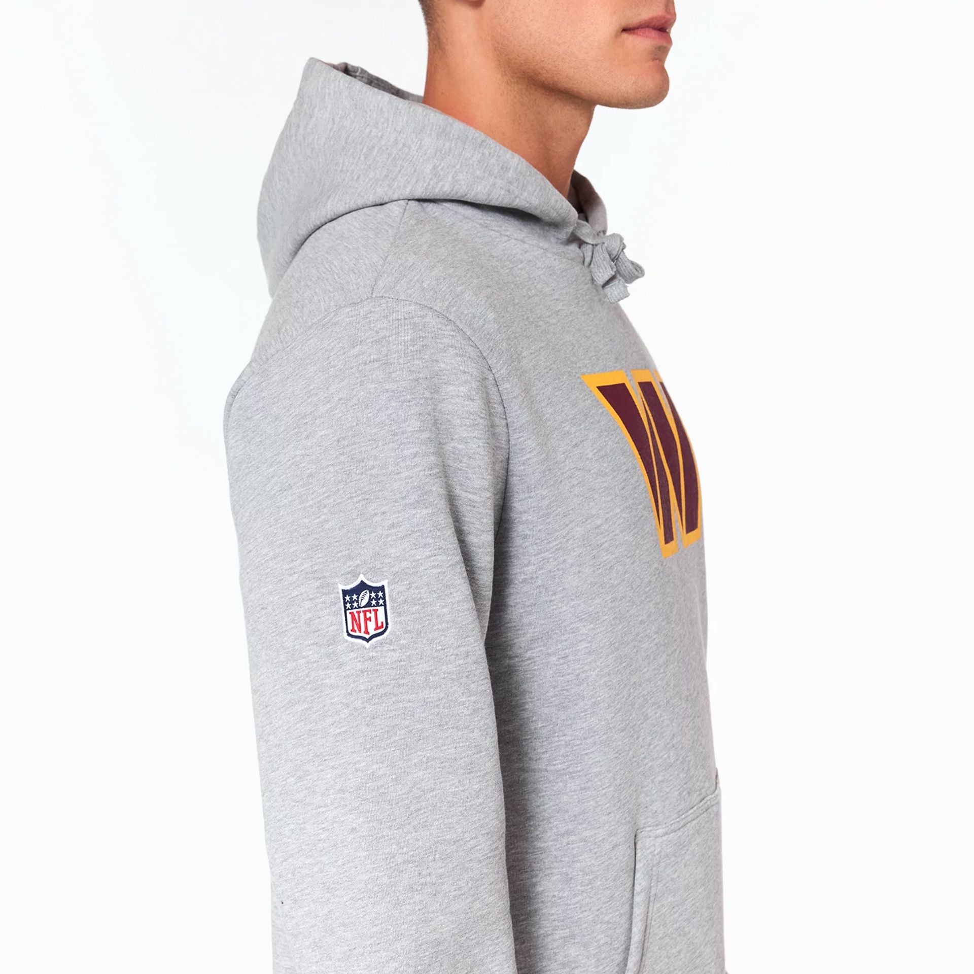 The Male model is wearing Washington Commanders NFL Grey Pullover Hoodie 3