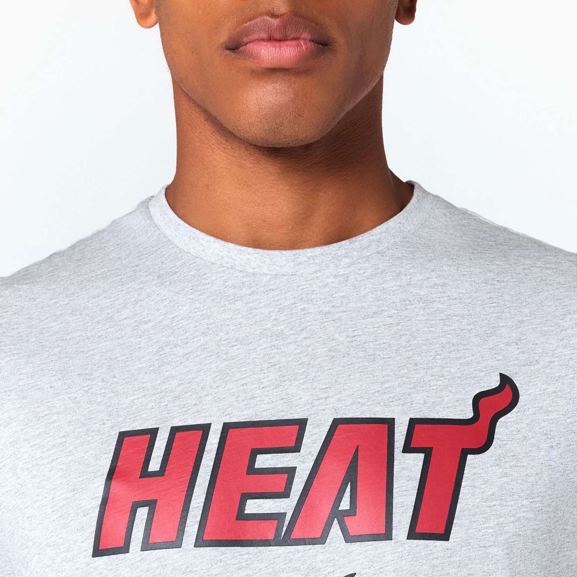 The Male model is wearing Miami Heat NBA Grey T-Shirt 3