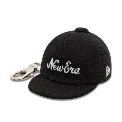 This is a New Era New Era Mini Cap Black Key Chain 1