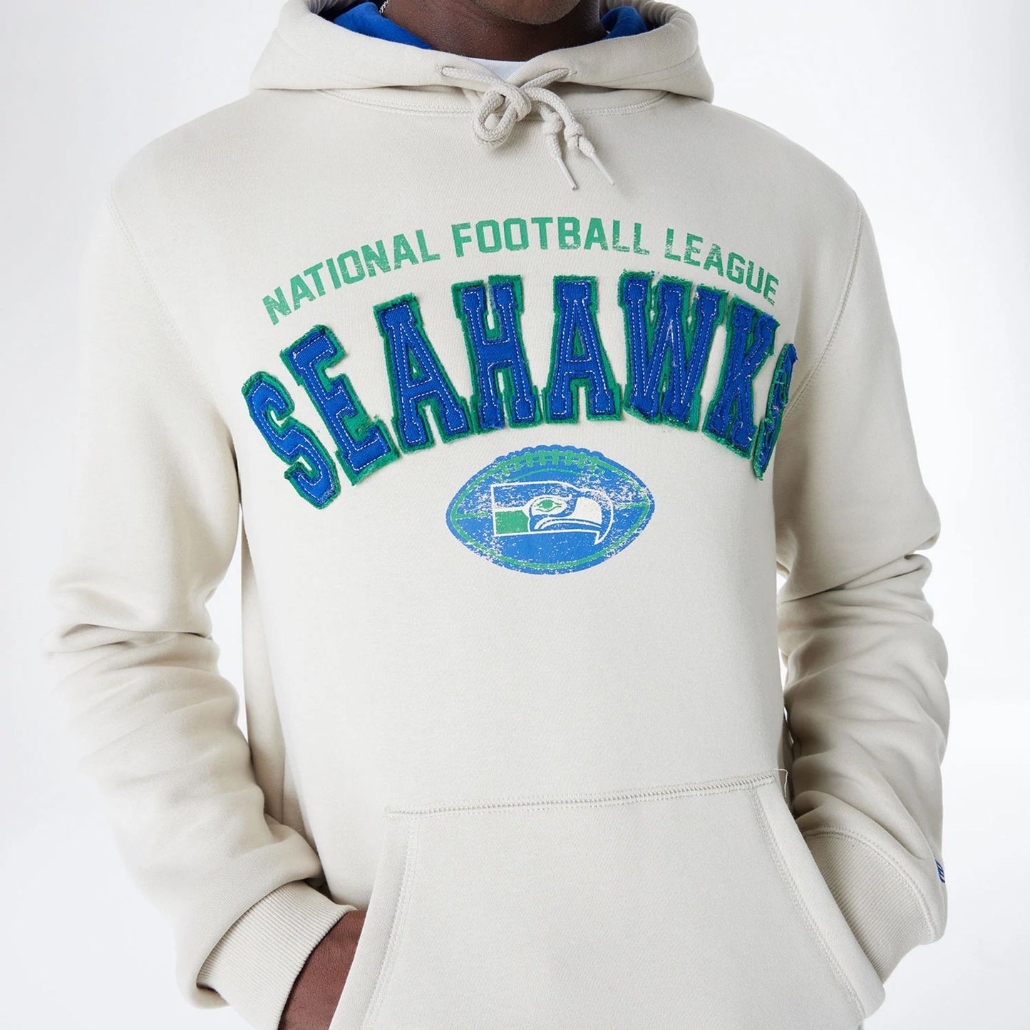 The Male model is wearing Seattle Seahawks NFL 3rd Down Historic Light Beige Pullover Hoodie  3