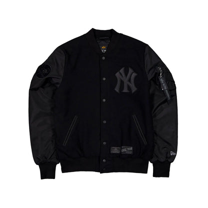 The Male model is wearing New York Yankees MLB x Alpha Industries Black On Black Varsity Jacket 1