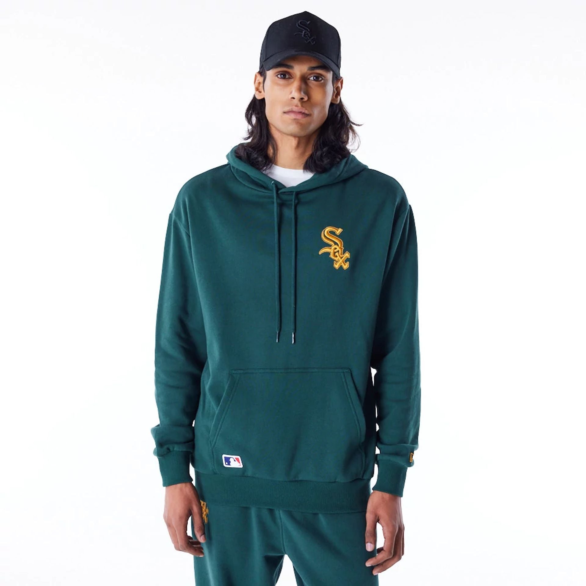 The Male model is wearing Chicago White Sox League Essential Dark Green Oversized Pullover Hoodie 1