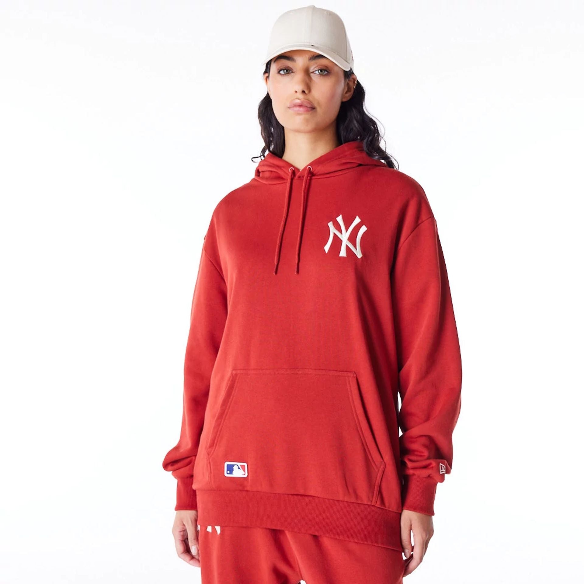 The Male model is wearing New York Yankees League Essential Red Oversized Pullover Hoodie 3