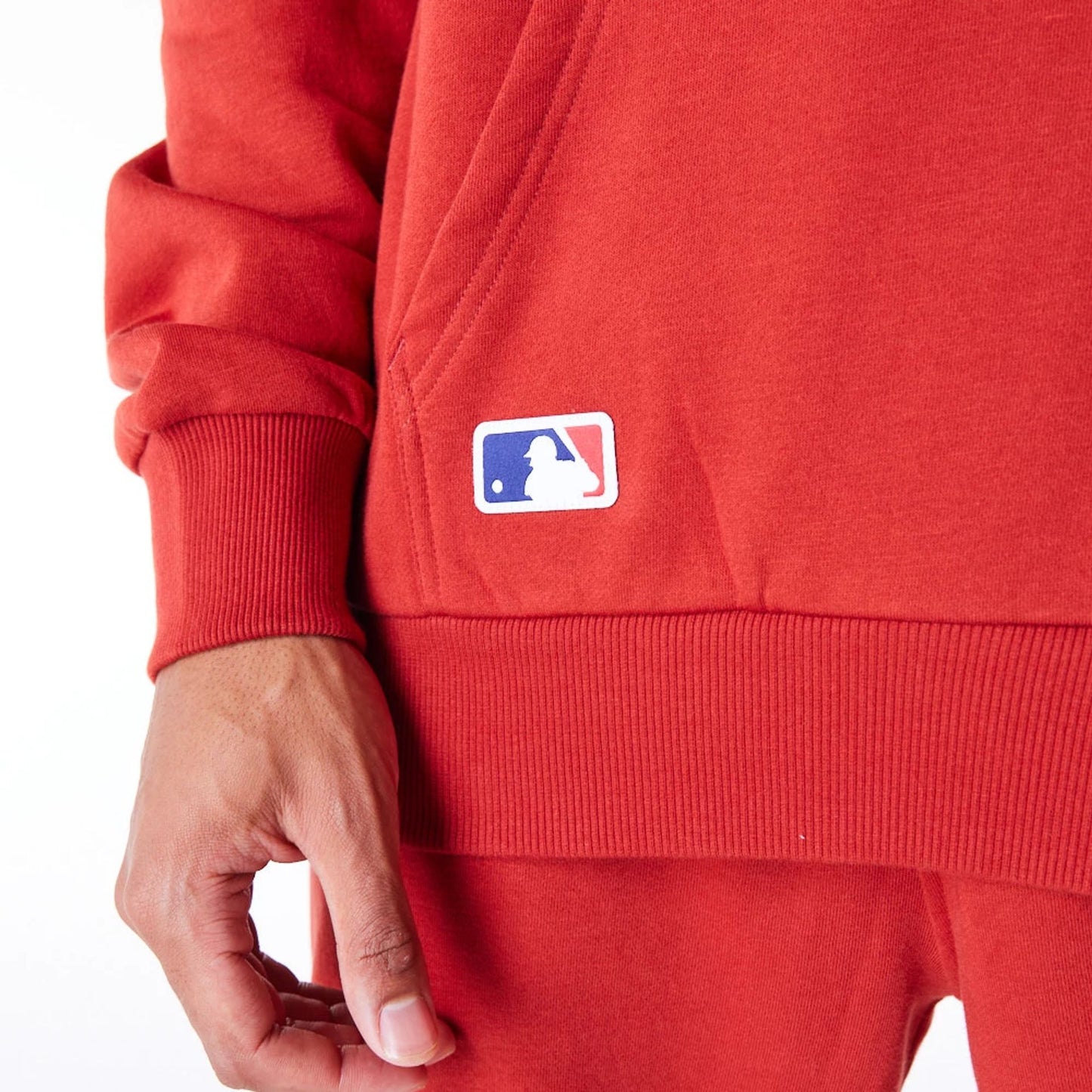 The Male model is wearing New York Yankees League Essential Red Oversized Pullover Hoodie 7